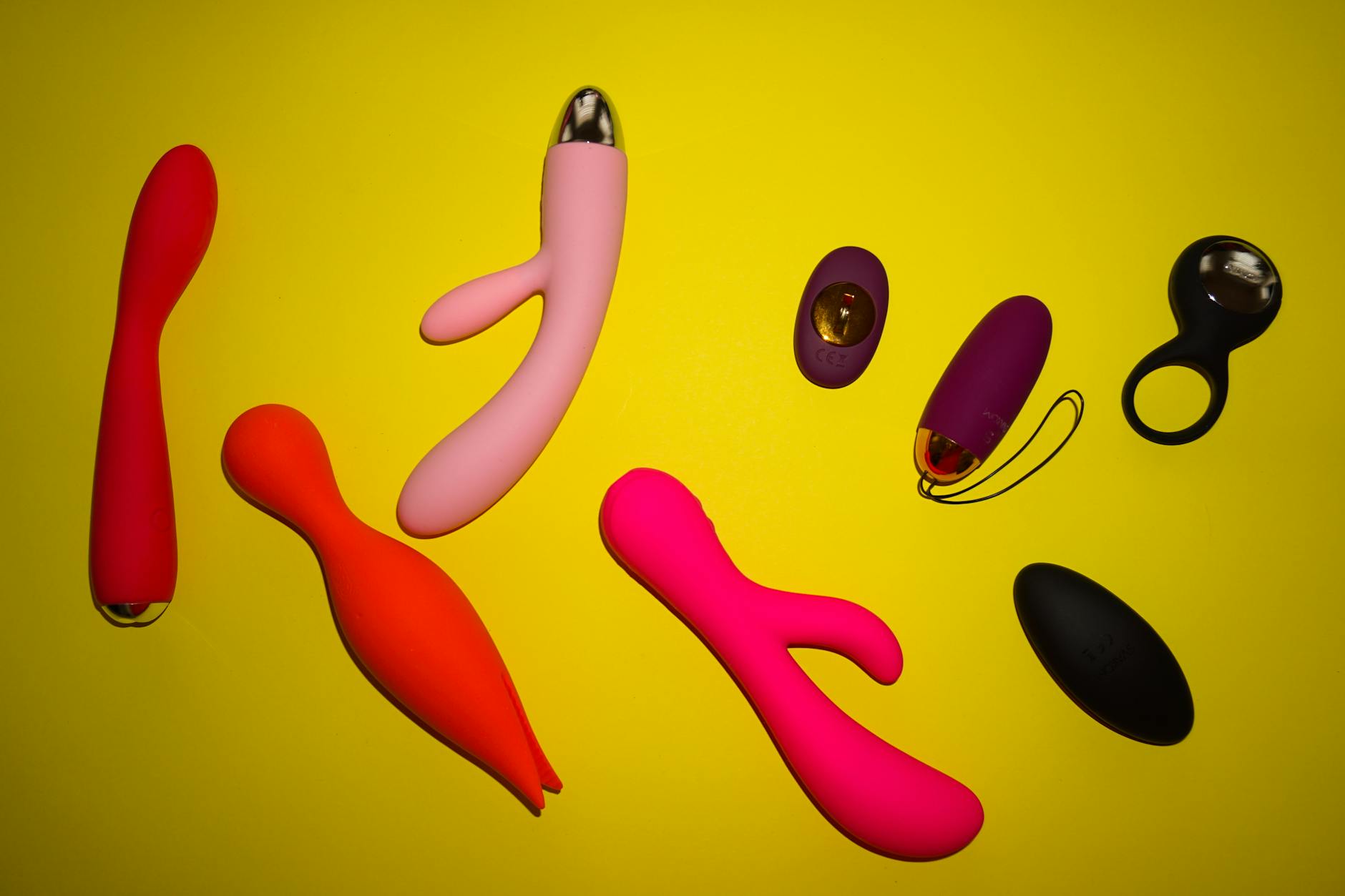Close-up of hands holding a sleek vibrator, emphasizing intimate personal connection and mindful pleasure