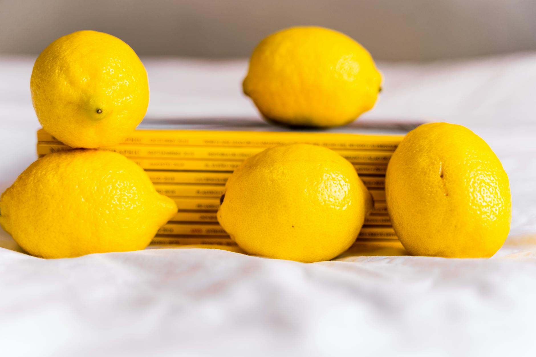 Bright yellow lemons on a vibrant background symbolizing freshness and natural vitality